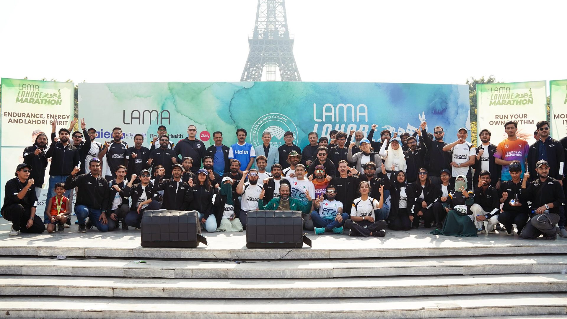 The Lahore Marathon team and volunteers gathered on the steps before the race
